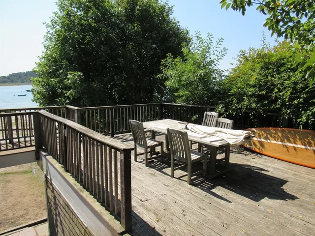 a view of a balcony with two chairs and a table