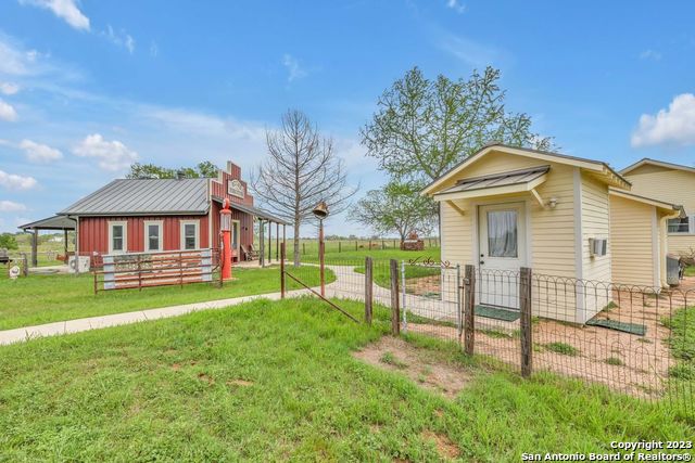 16547 East Gable Road St. Hedwig, TX 78152 - Photo 19 of 38 a view of a house with a yard and sitting area