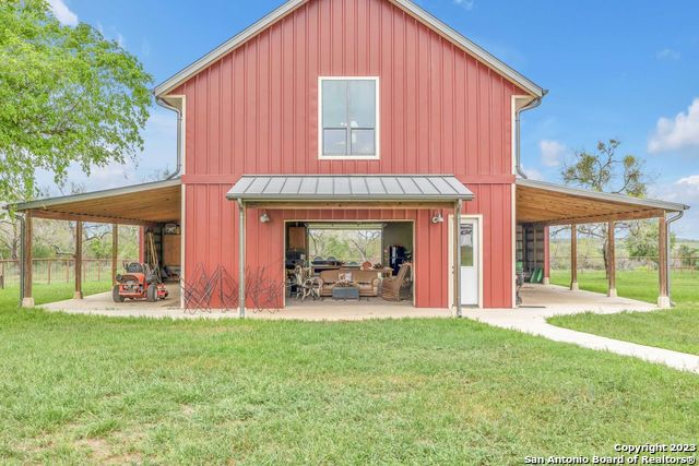 16547 East Gable Road St. Hedwig, TX 78152 - Photo 20 of 38 a view of a house with sitting area and garden