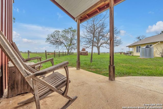 16547 East Gable Road St. Hedwig, TX 78152 - Photo 21 of 38 a view of a two chairs in the back yard