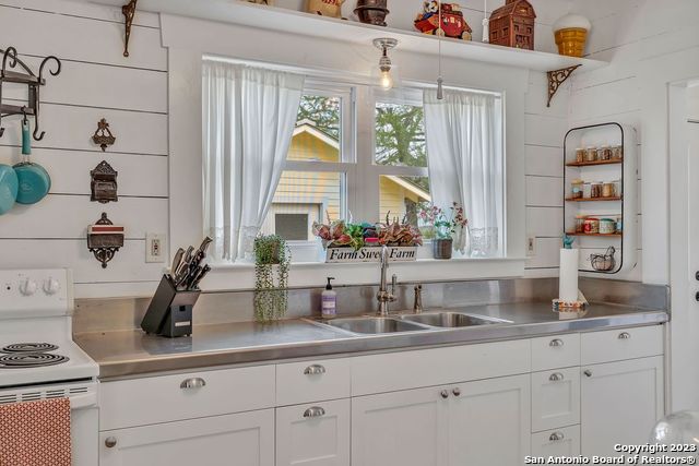 16547 East Gable Road St. Hedwig, TX 78152 - Photo 22 of 38 a kitchen with counter top space and large windows