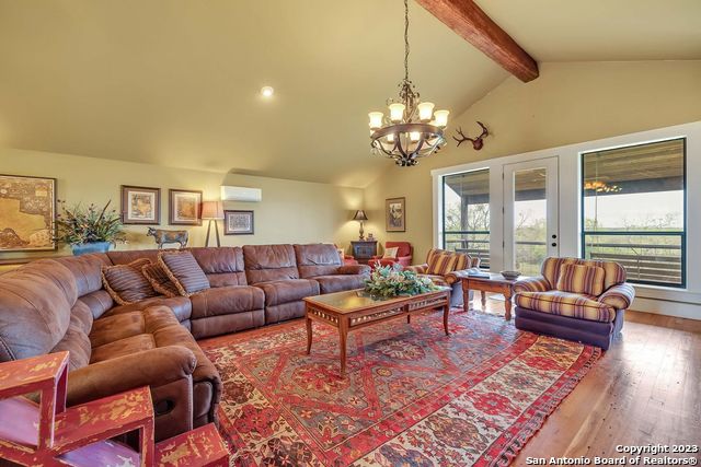 16547 East Gable Road St. Hedwig, TX 78152 - Photo 26 of 38 a living room with furniture chandelier and a table