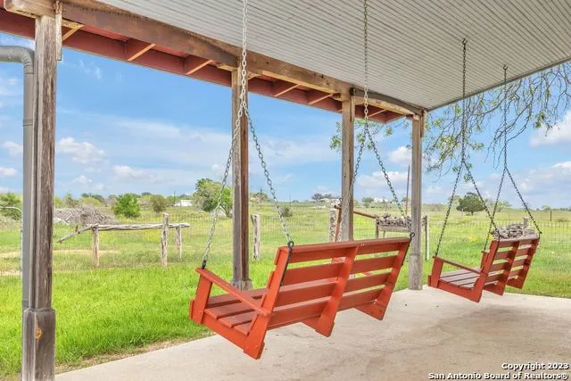 a view of a lake with houses in the back