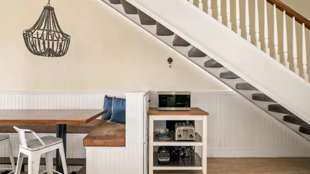 a view of a room with furniture and a window