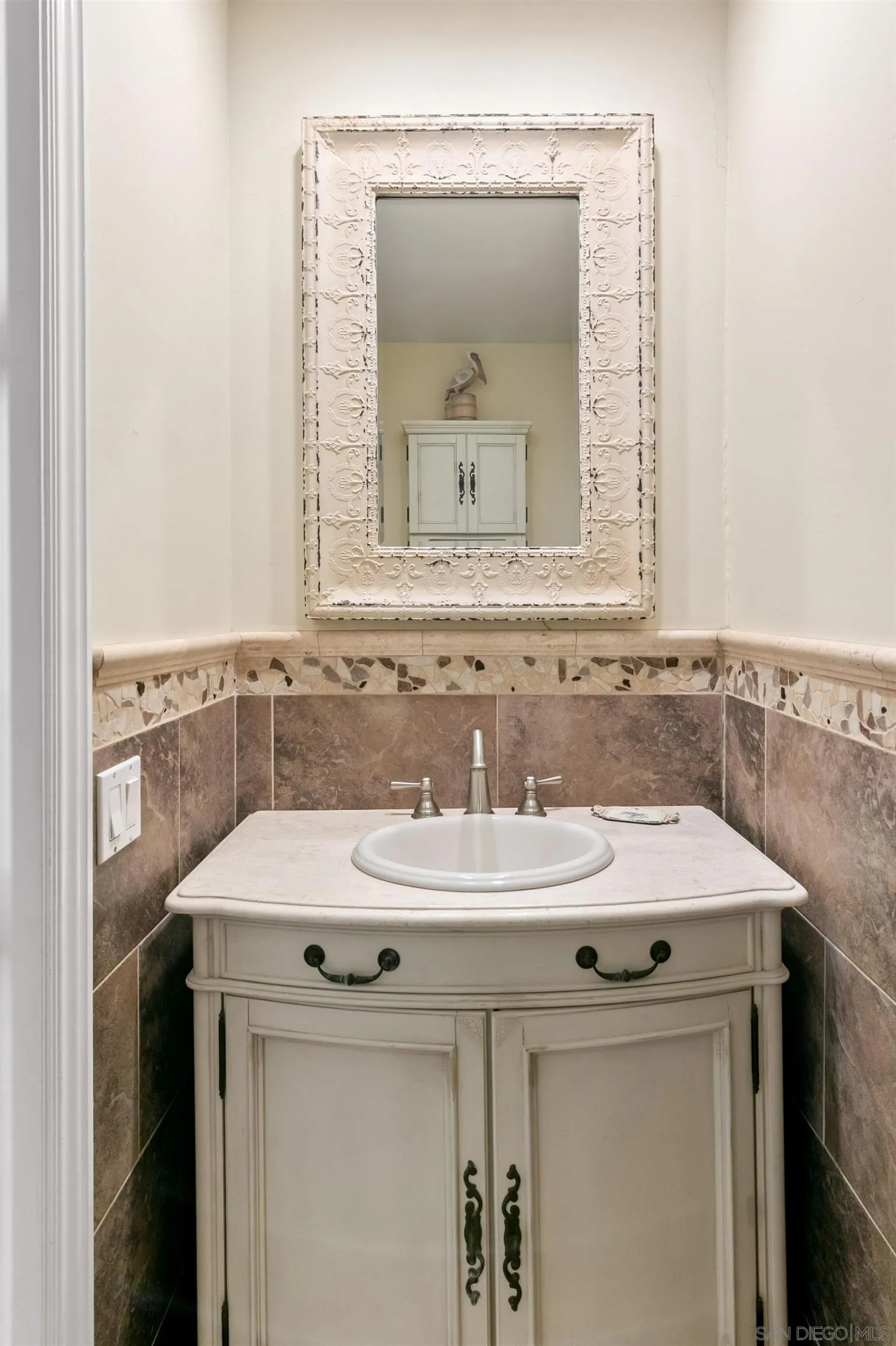 3285 Ocean Front Walk, Unit 3 San Diego, CA 92109 - Photo 15 of 38 a bathroom with a sink and a mirror