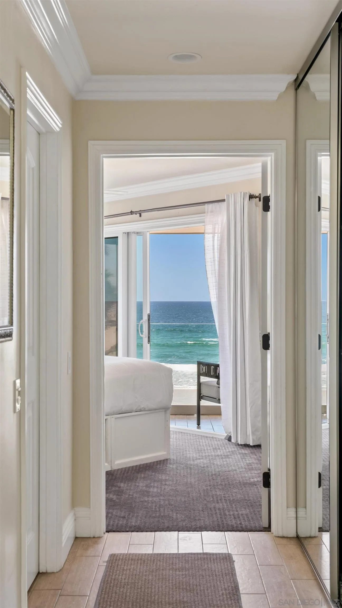 3285 Ocean Front Walk, Unit 3 San Diego, CA 92109 - Photo 16 of 38 a living room with furniture and a window