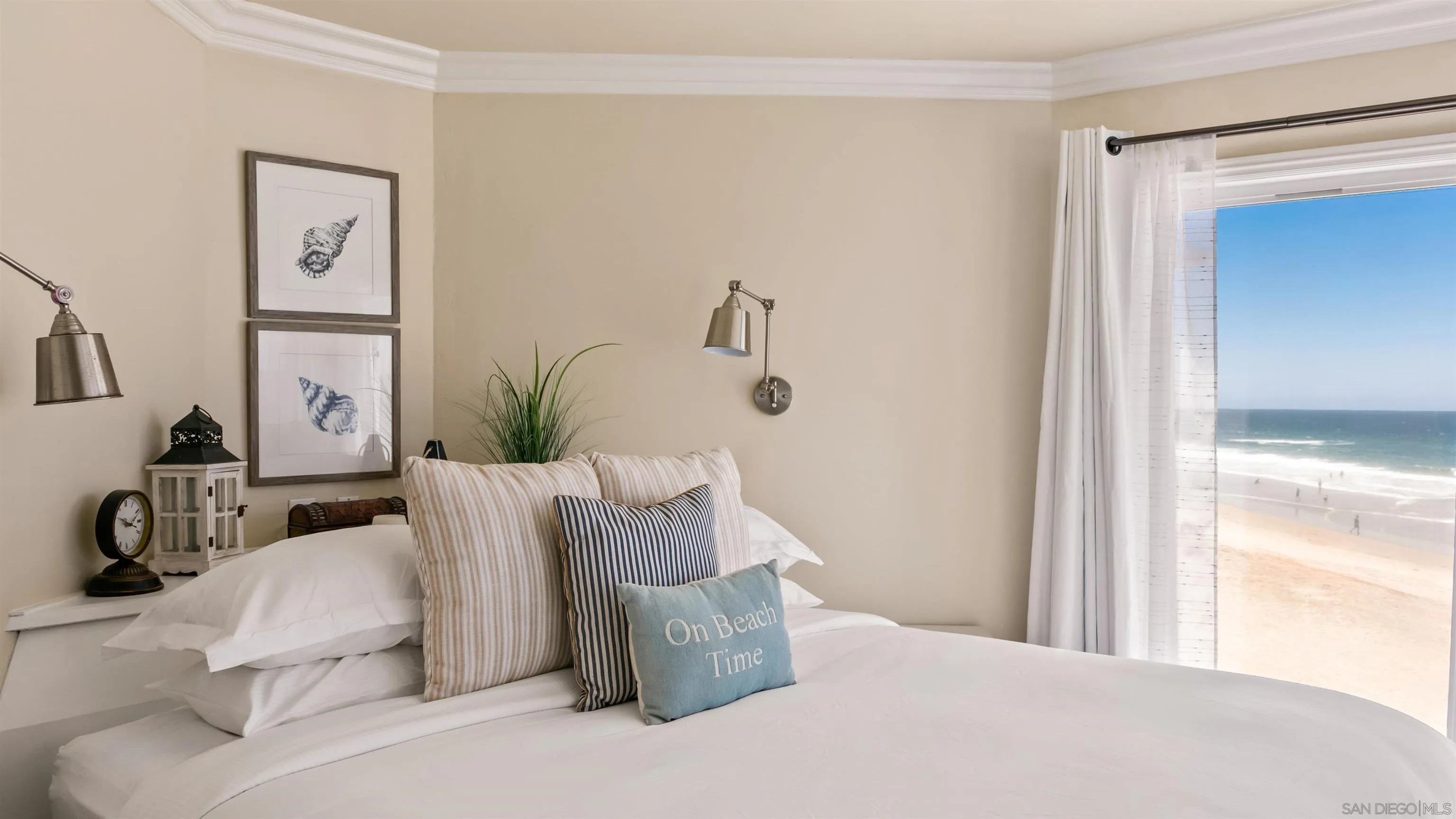 3285 Ocean Front Walk, Unit 3 San Diego, CA 92109 - Photo 17 of 38 a bedroom with a bed and a window