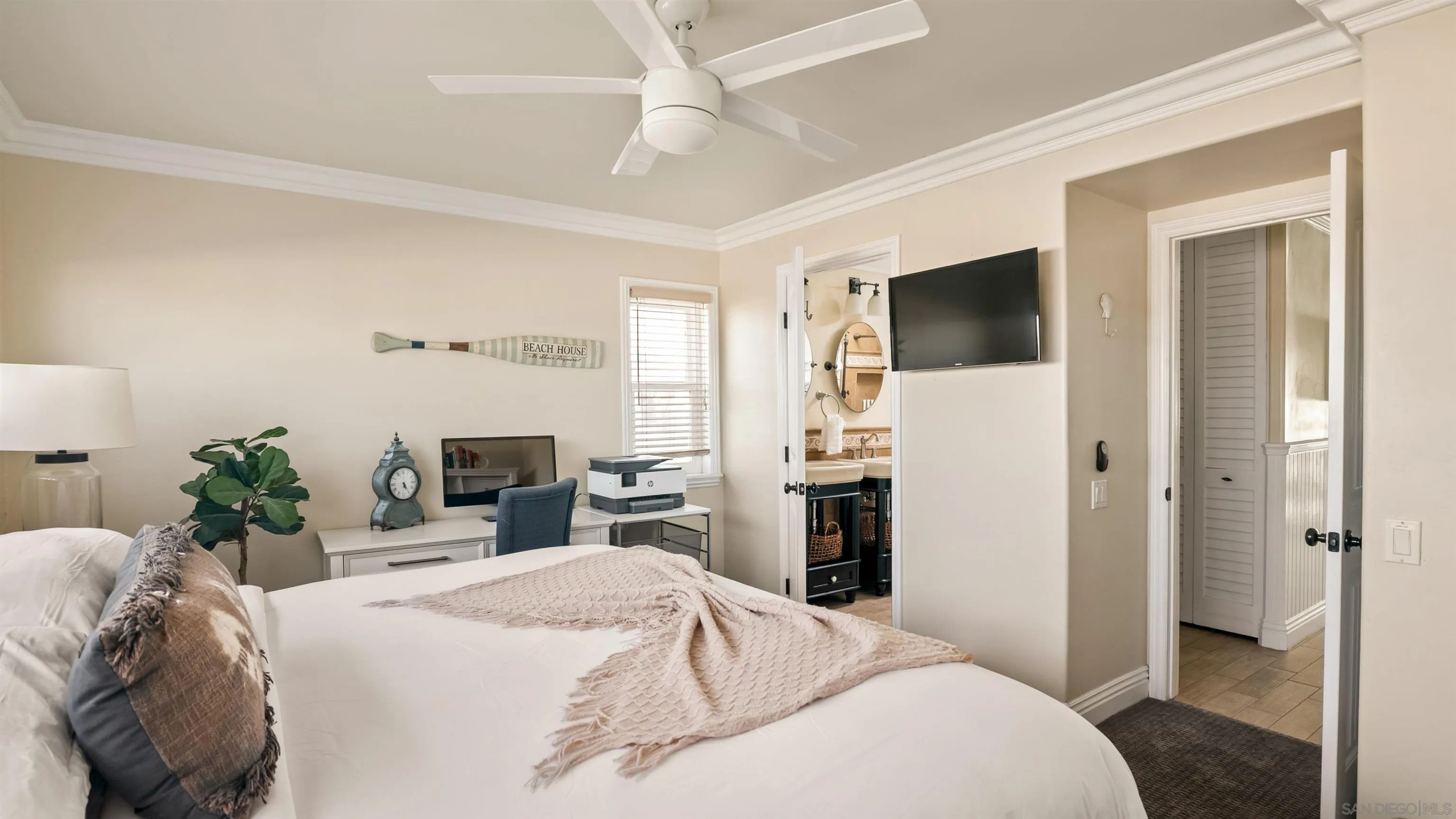 3285 Ocean Front Walk, Unit 3 San Diego, CA 92109 - Photo 29 of 38 a bedroom with a bed and a flat screen tv