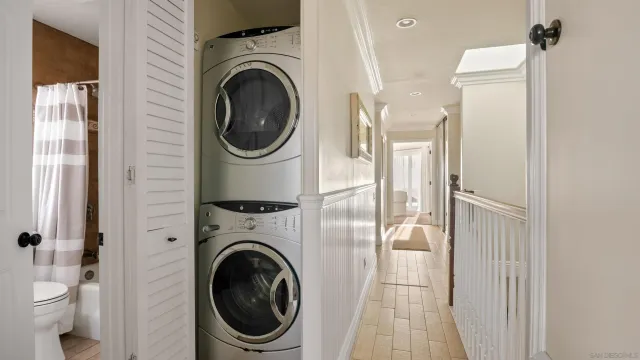 a view of a balcony with furniture and floor to ceiling window