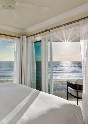 a view of a terrace with furniture and city view