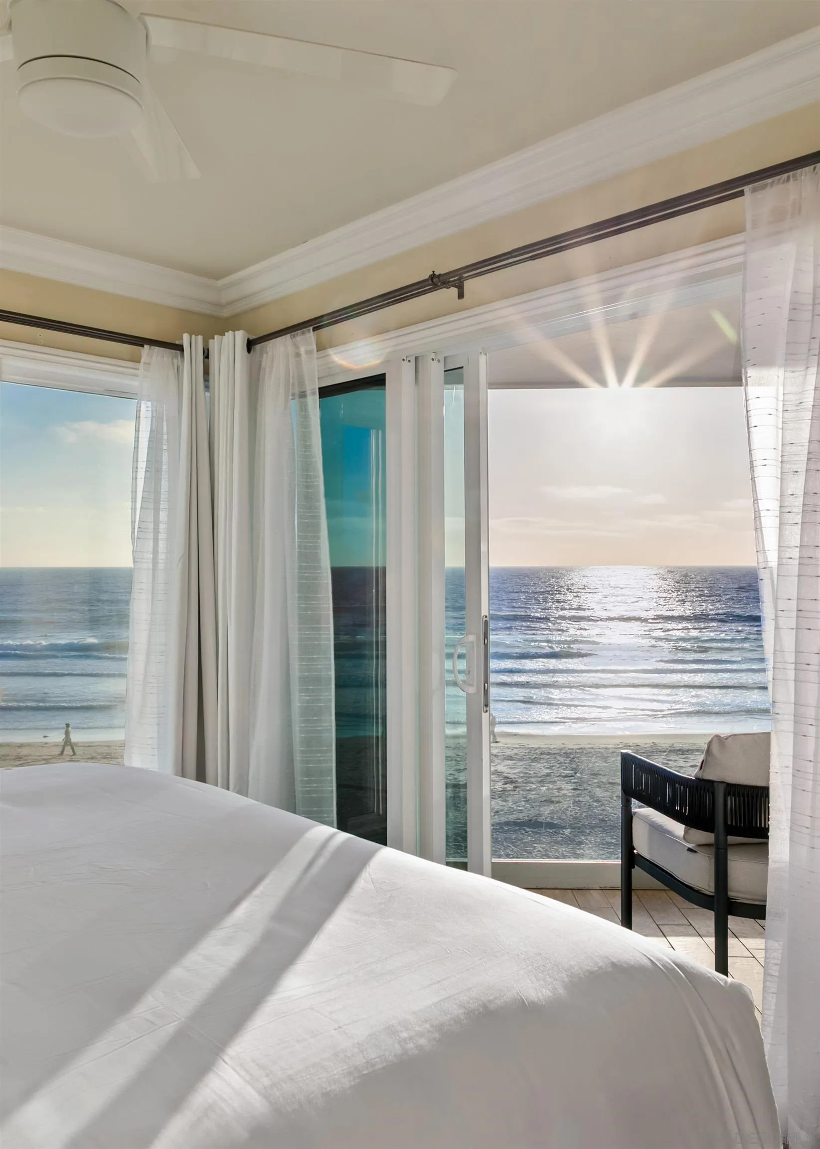 3285 Ocean Front Walk, Unit 3 San Diego, CA 92109 - Photo 31 of 38 a bedroom with a bed and large window