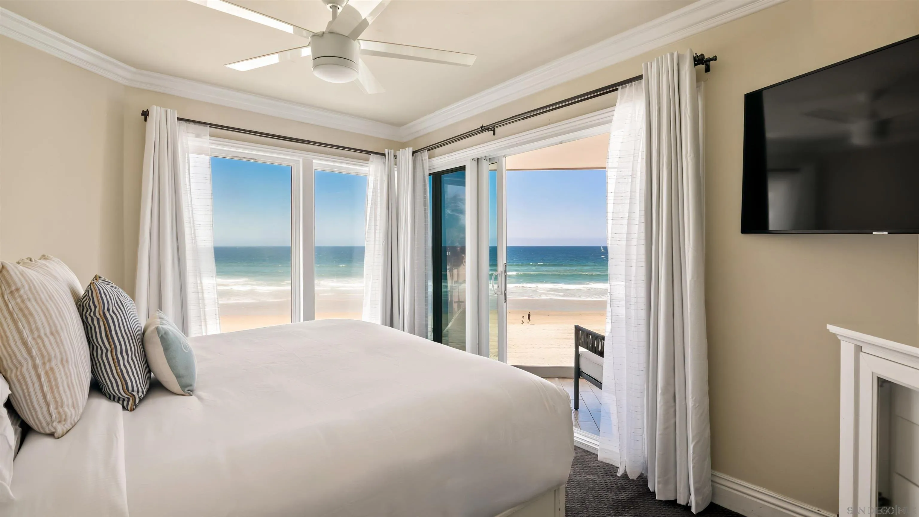 3285 Ocean Front Walk, Unit 3 San Diego, CA 92109 - Photo 5 of 38 a bedroom with a bed and a large mirror