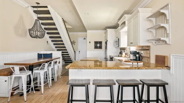 a living room with furniture flat screen tv and a window