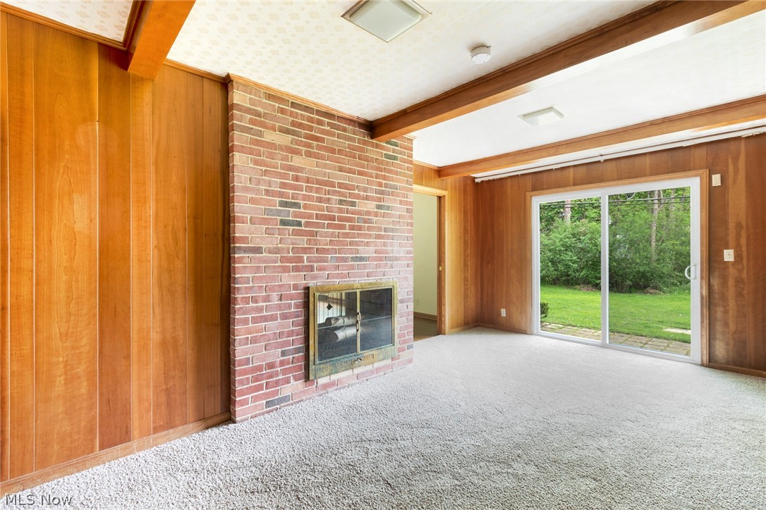 176 Pembroke Road Akron, OH 44333 - Photo 13 of 28 FAMILY ROOM OR DEN WITH COZY WOOD PANELING & SLIDING GLASS DOOR TO BACKYARD.
