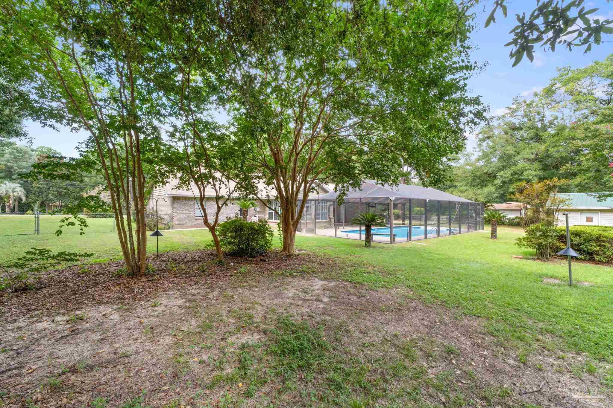 5645 Windham Road Milton, FL 32570 - Photo 32 of 40 a view of a house with a backyard