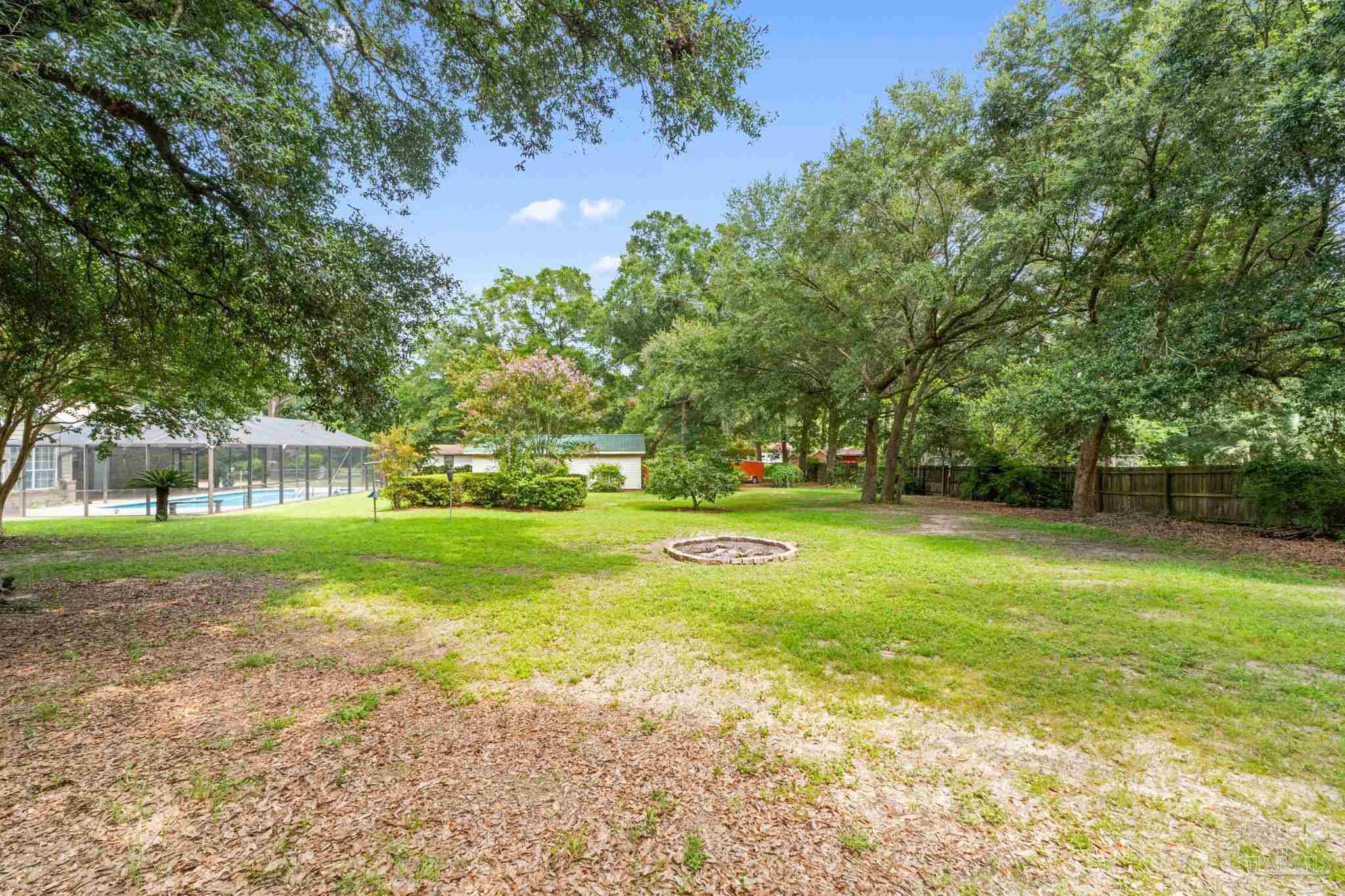 5645 Windham Road Milton, FL 32570 - Photo 33 of 40 a view of a house with a yard