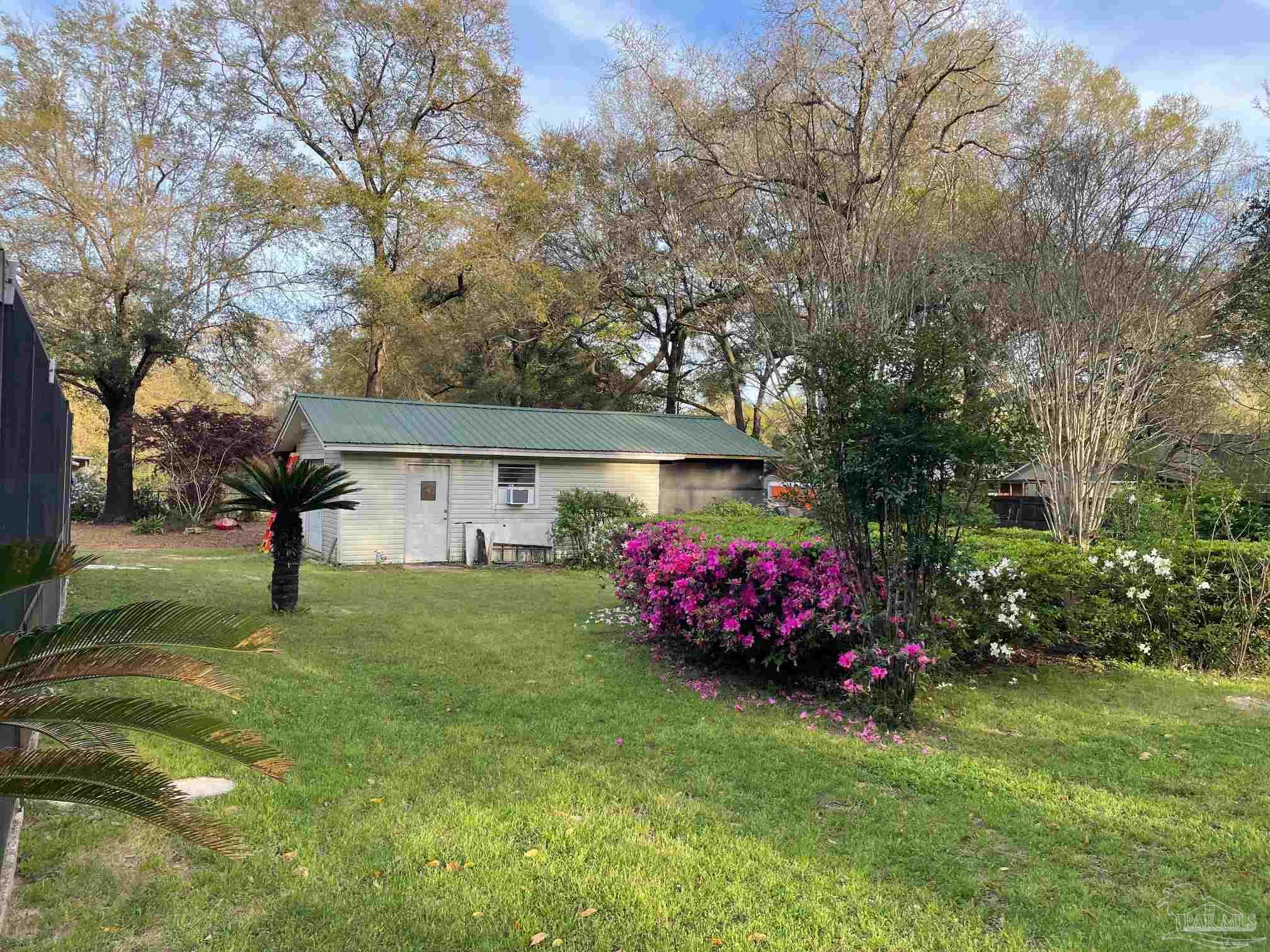 5645 Windham Road Milton, FL 32570 - Photo 37 of 40 a view of a house with a yard and tree s