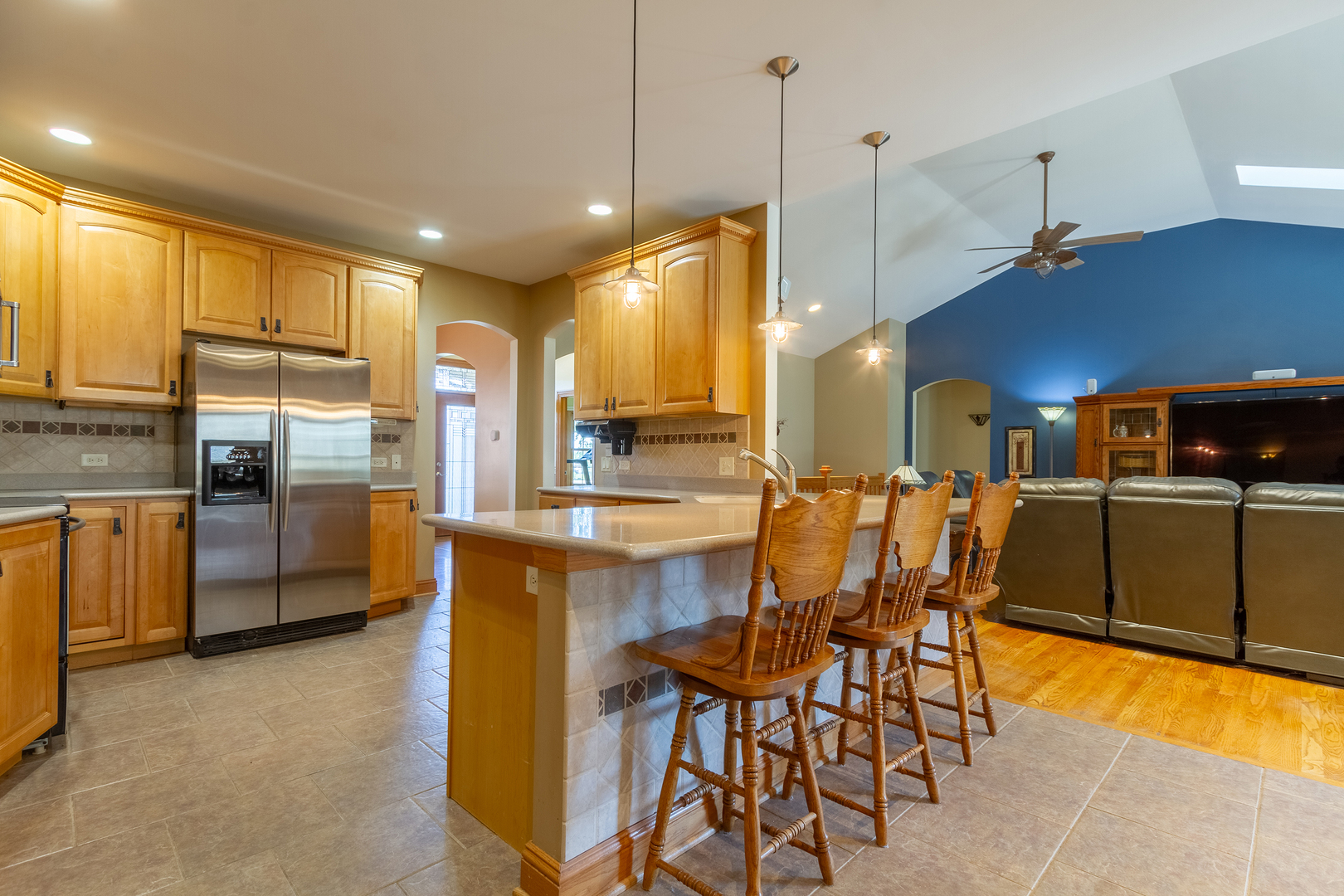 285 Valley Way Burlington, IL 60109 - Photo 11 of 40 a kitchen with stainless steel appliances kitchen island granite countertop a table and chairs