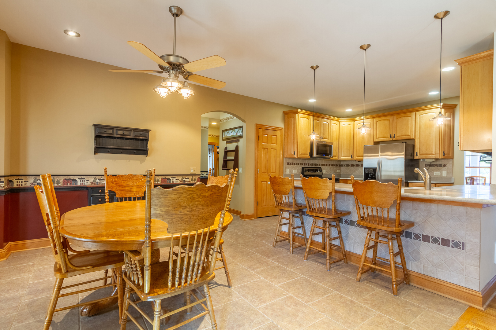 285 Valley Way Burlington, IL 60109 - Photo 15 of 40 a view of a dining room with furniture and a chandelier