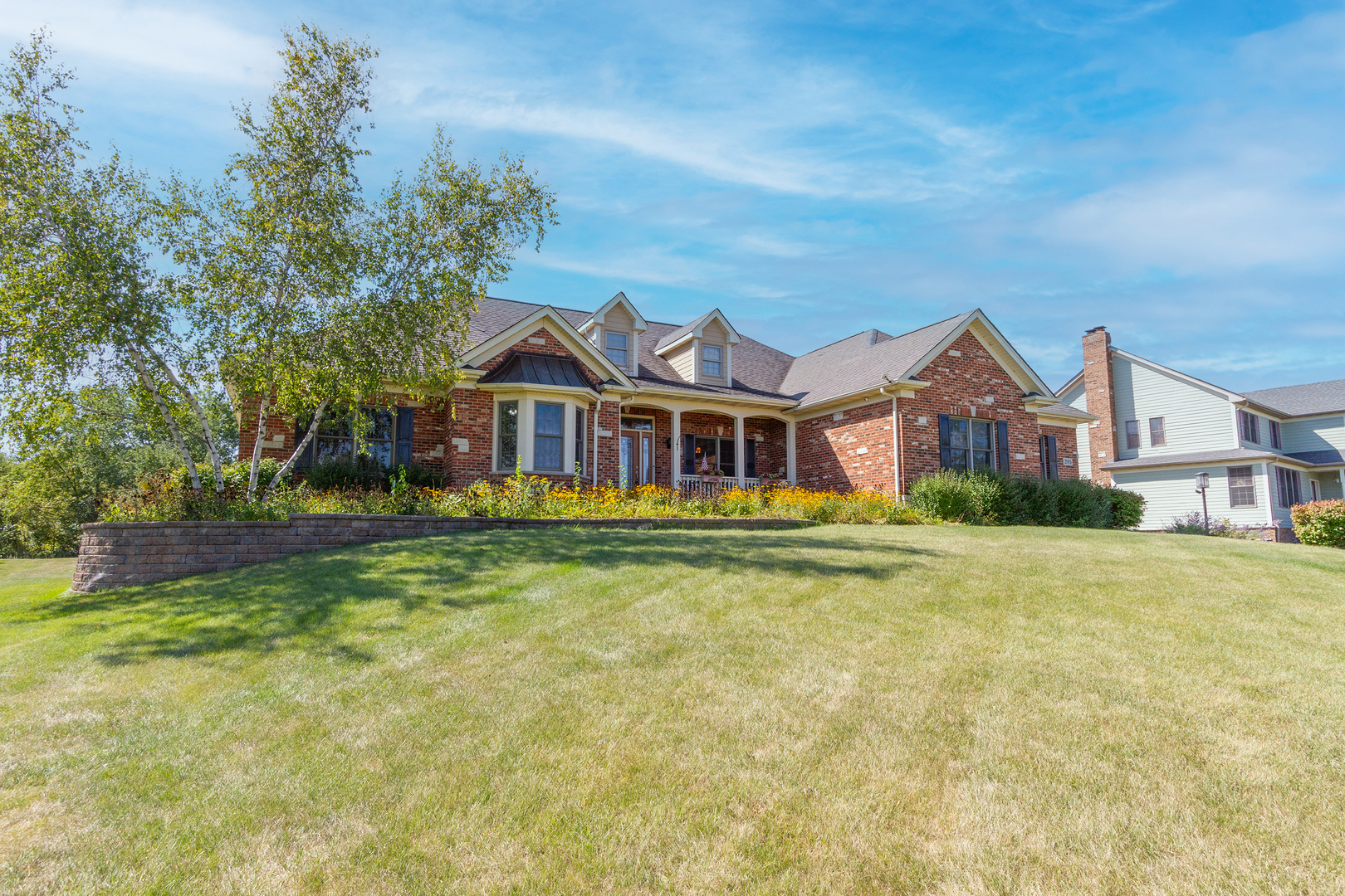 285 Valley Way Burlington, IL 60109 - Photo 2 of 40 a front view of house with yard and trees in the background