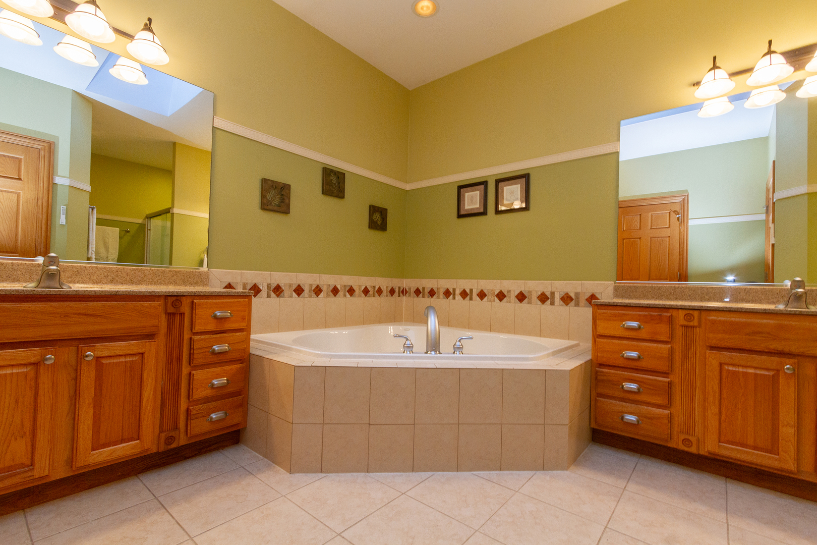 285 Valley Way Burlington, IL 60109 - Photo 26 of 40 a spacious bathroom with a tub sink and mirror