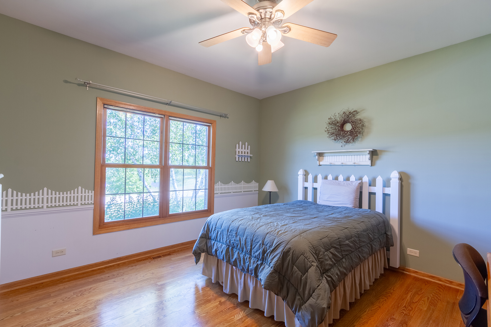 285 Valley Way Burlington, IL 60109 - Photo 27 of 40 a bedroom with a bed and a chandelier