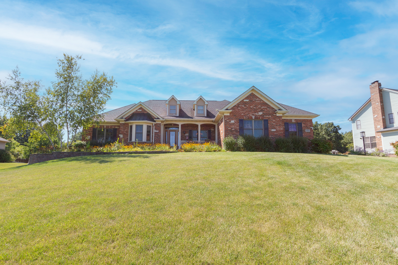 285 Valley Way Burlington, IL 60109 - Photo 3 of 40 a front view of house with yard and swimming pool