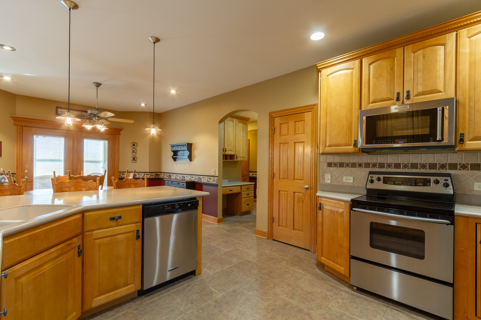285 Valley Way Burlington, IL 60109 - Photo 10 of 40 a kitchen with a sink stove and oven