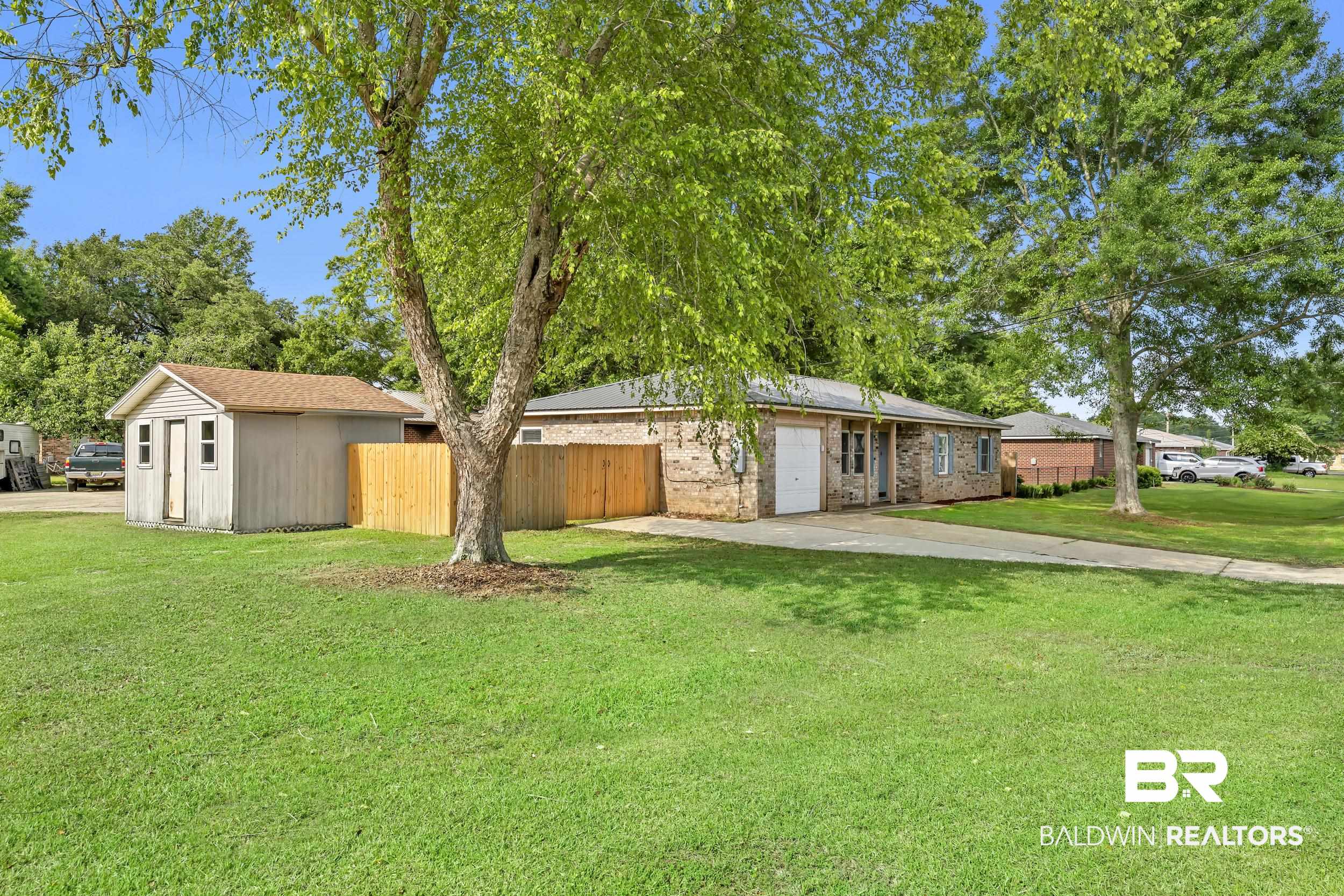 421 Cedar Court Foley, AL 36535 - Photo 6 of 39 Expansive front yard with mature trees