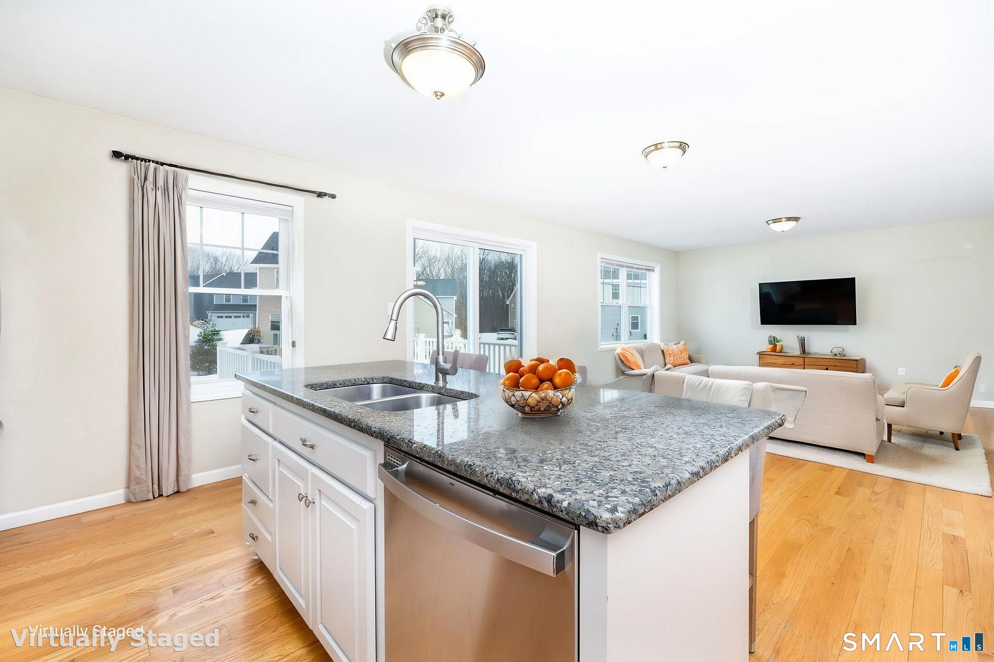 365 Allentown Road, Unit 34 Bristol, CT 06010 - Photo 11 of 43 a kitchen with a sink and a wooden floor