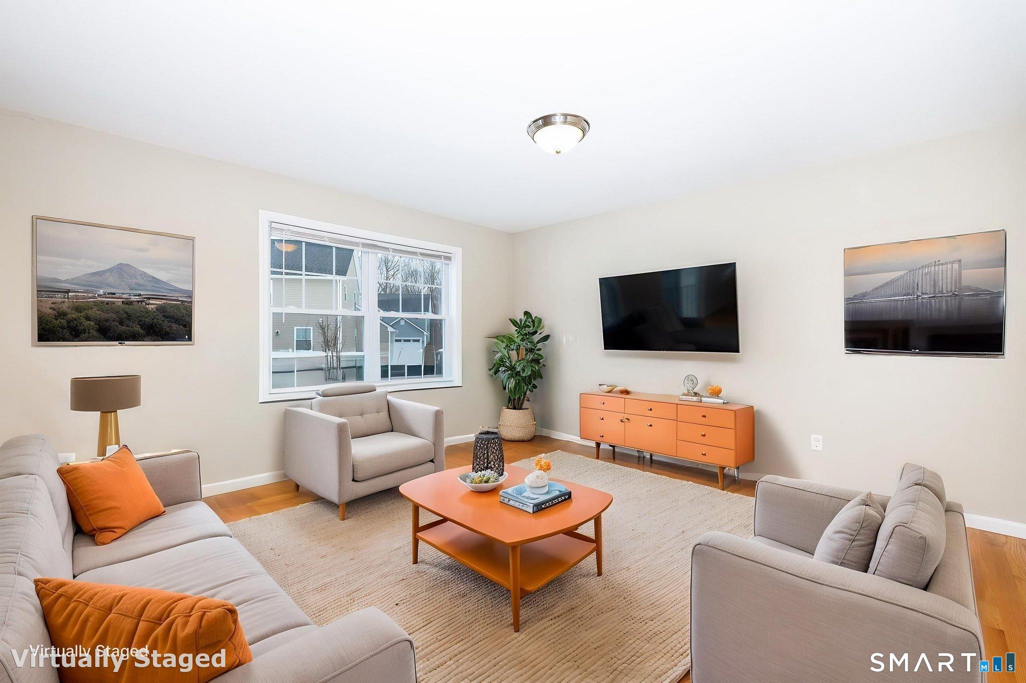 365 Allentown Road, Unit 34 Bristol, CT 06010 - Photo 16 of 43 a living room with furniture and a flat screen tv