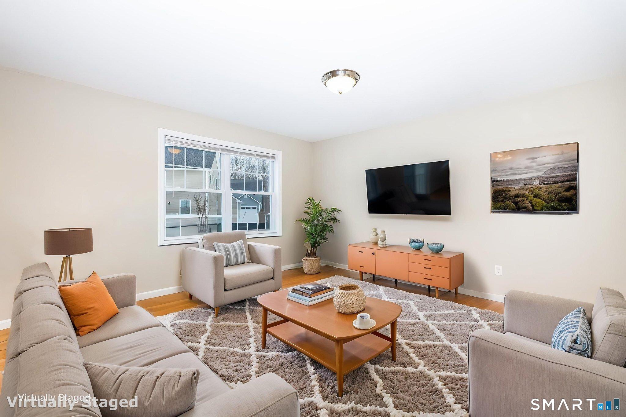 365 Allentown Road, Unit 34 Bristol, CT 06010 - Photo 17 of 43 a living room with furniture a flat screen tv and a window