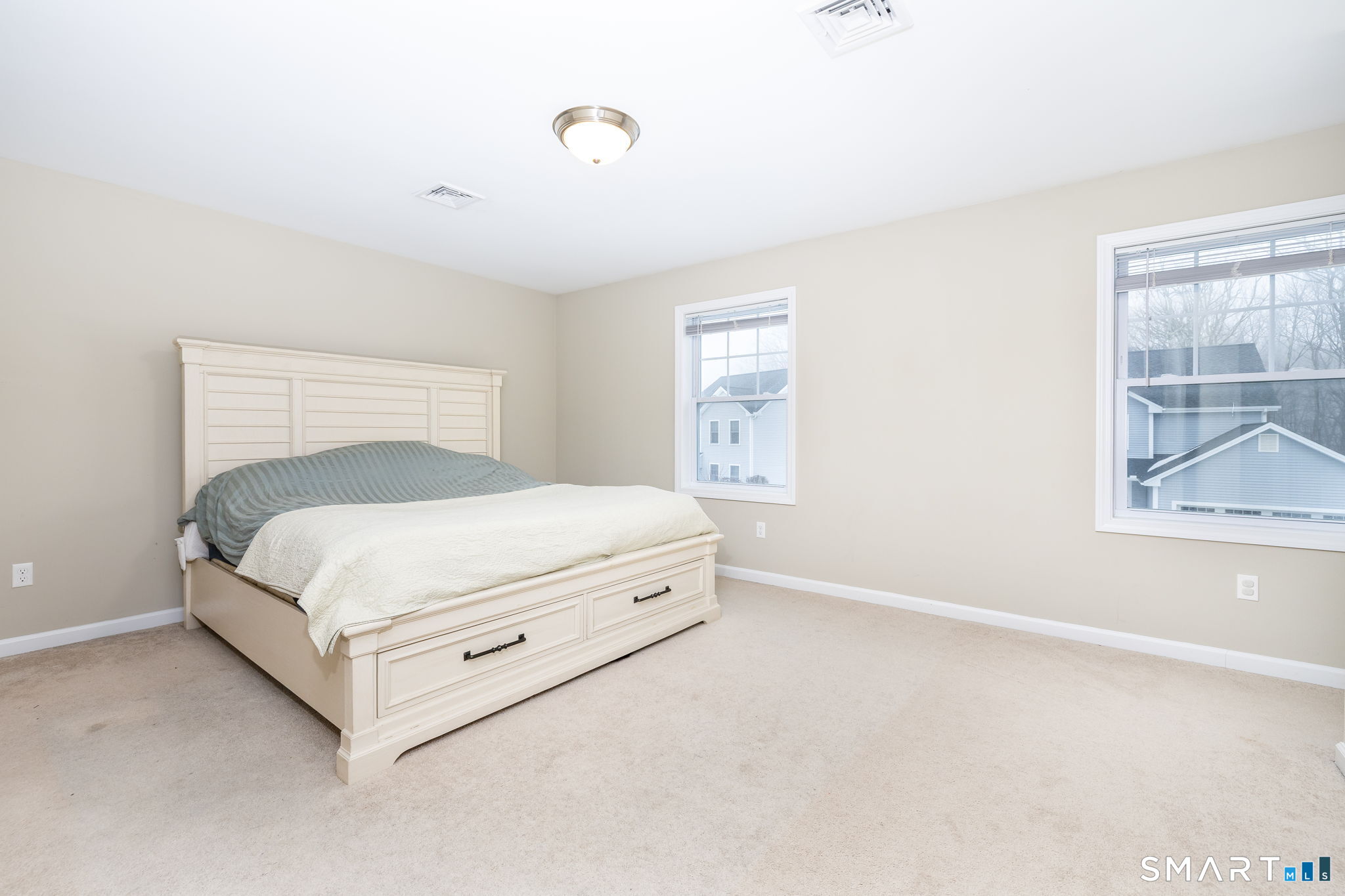 365 Allentown Road, Unit 34 Bristol, CT 06010 - Photo 20 of 43 a bed sitting in a bedroom next to a window