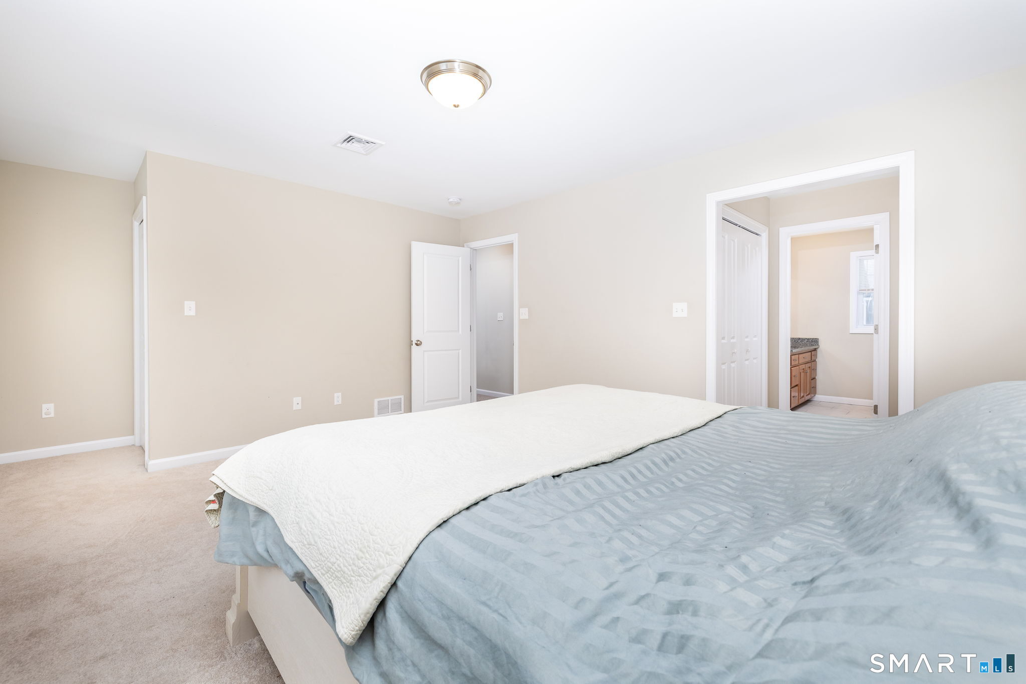 365 Allentown Road, Unit 34 Bristol, CT 06010 - Photo 24 of 43 a bedroom with a bed and a cabinets