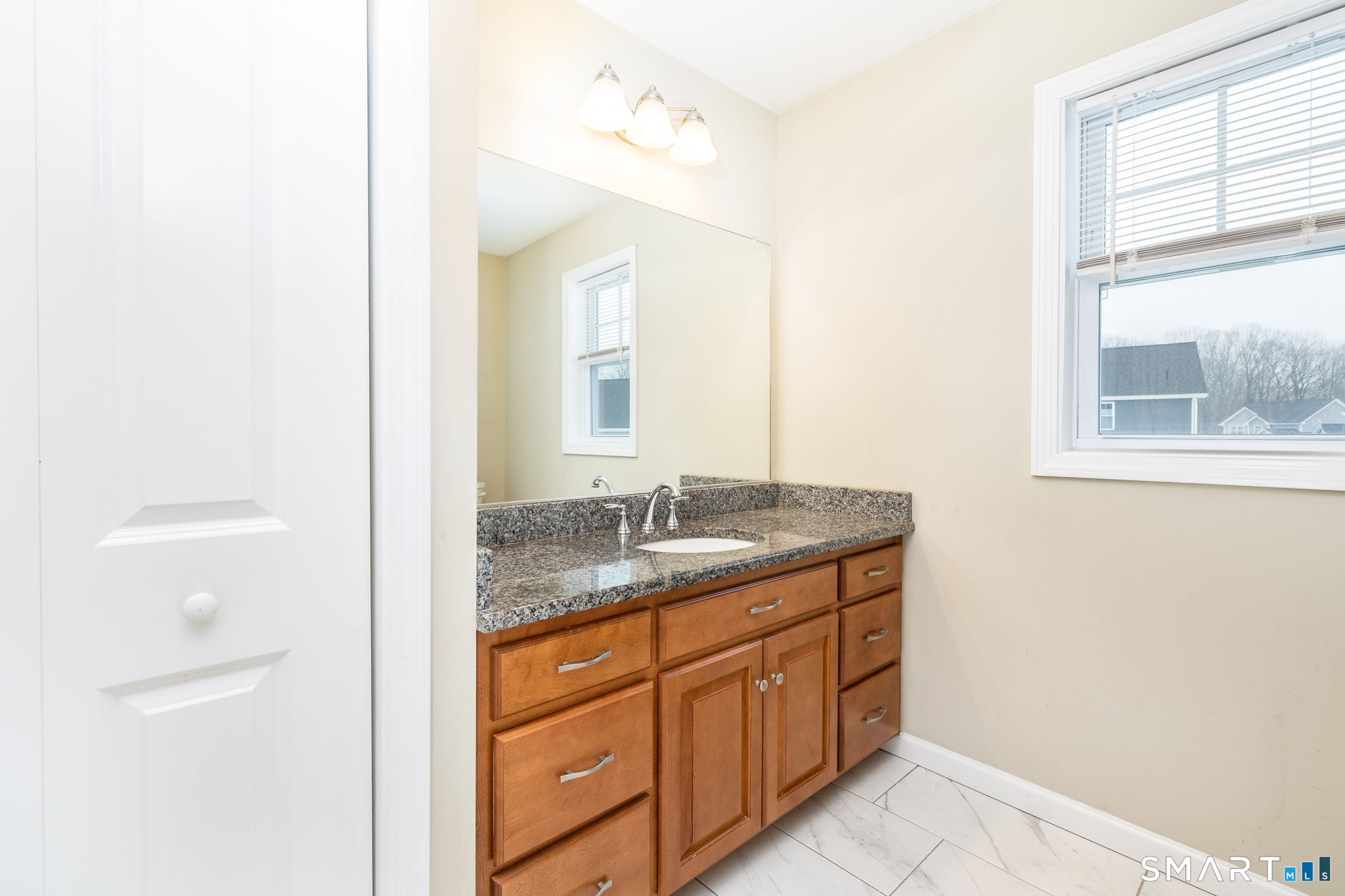 365 Allentown Road, Unit 34 Bristol, CT 06010 - Photo 26 of 43 a bathroom with a granite countertop sink and a mirror