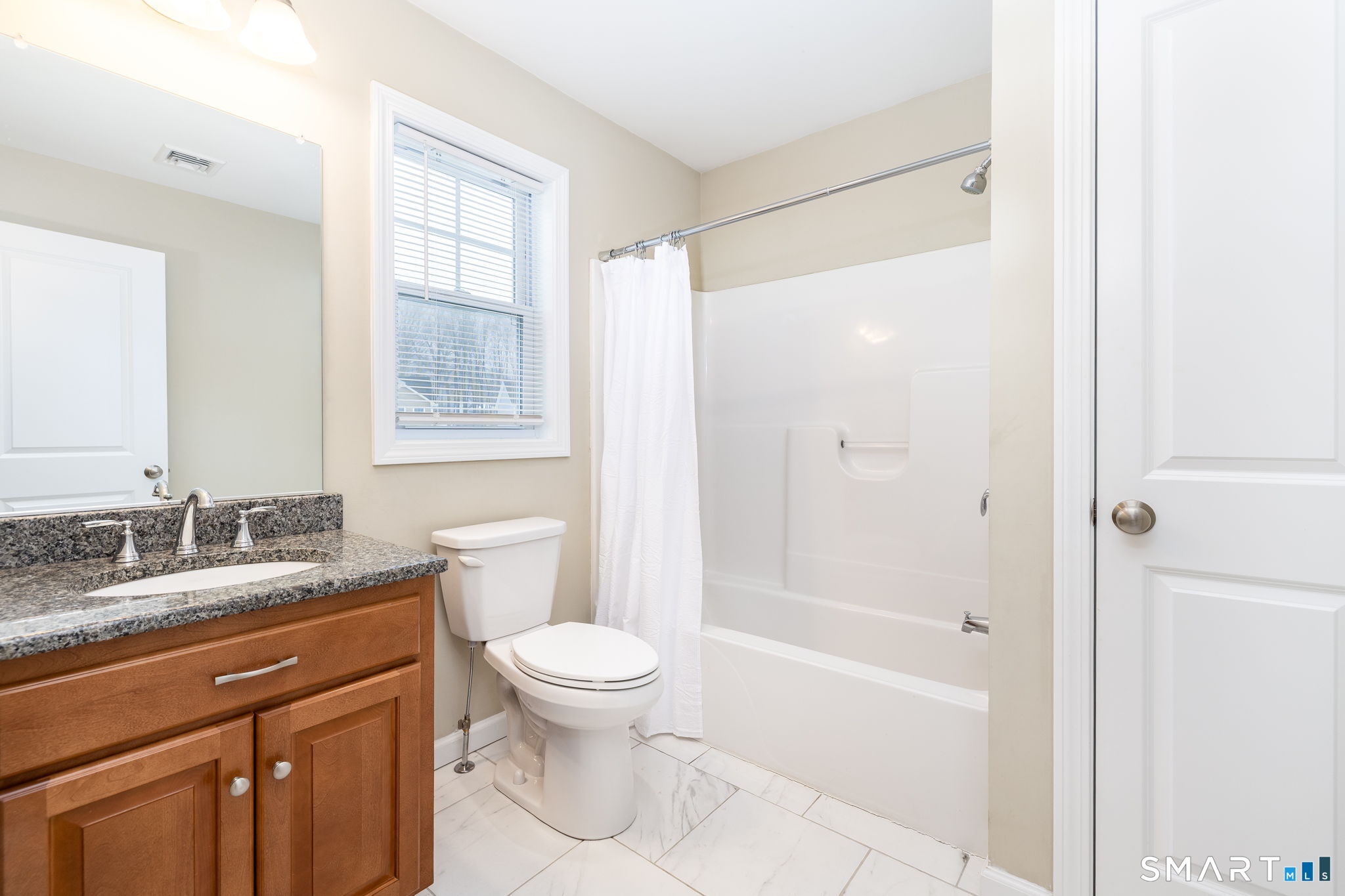 365 Allentown Road, Unit 34 Bristol, CT 06010 - Photo 32 of 43 a bathroom with a granite countertop sink a toilet and shower
