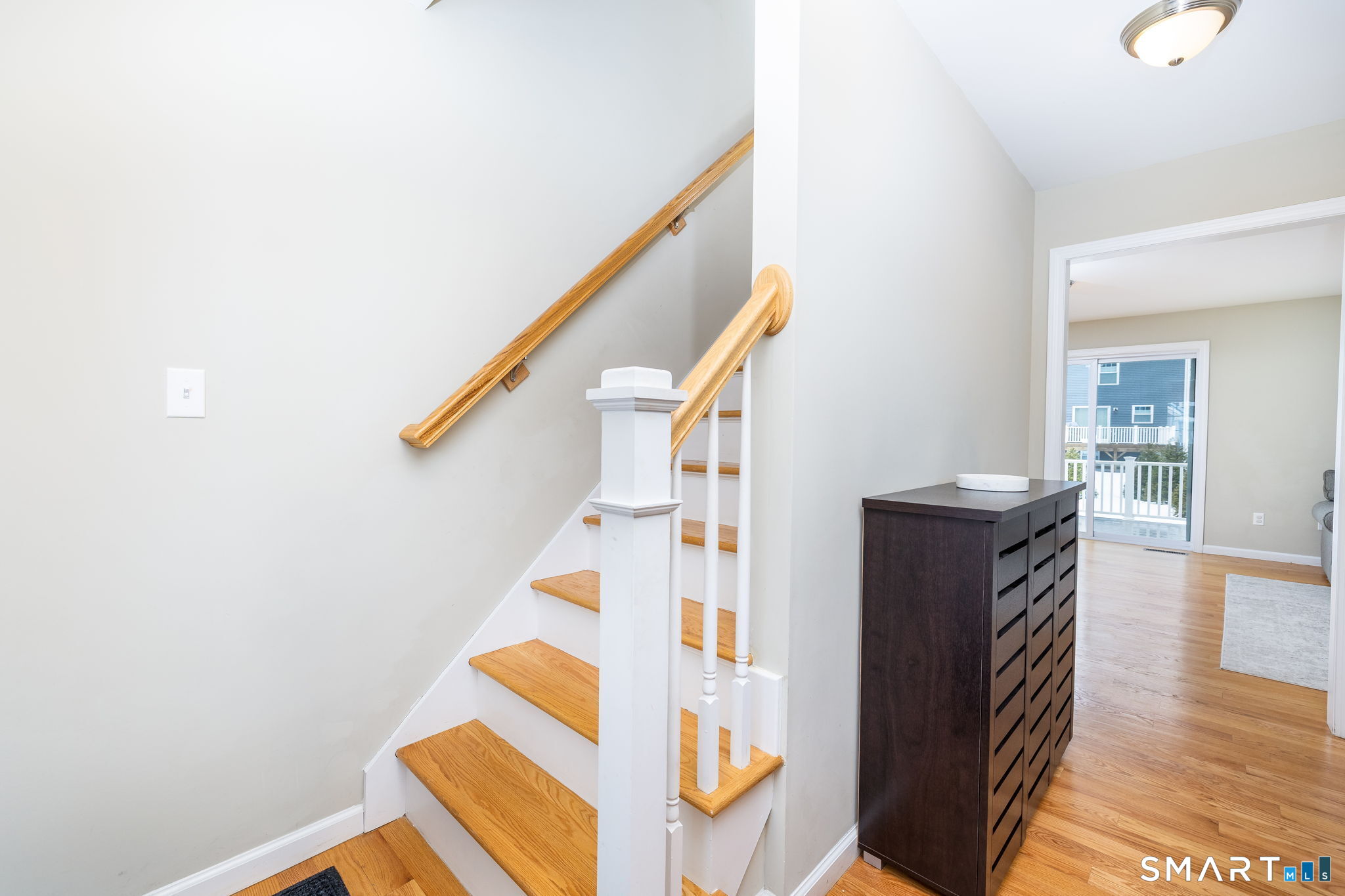 365 Allentown Road, Unit 34 Bristol, CT 06010 - Photo 5 of 43 a view of entryway kitchen and hall with wooden floor