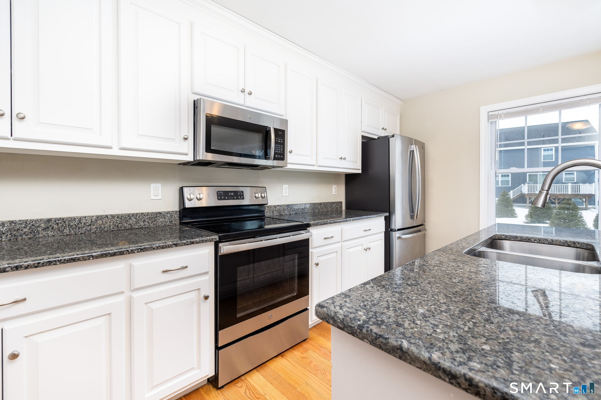 365 Allentown Road, Unit 34 Bristol, CT 06010 - Photo 8 of 43 a kitchen with stainless steel appliances granite countertop a sink stove and refrigerator