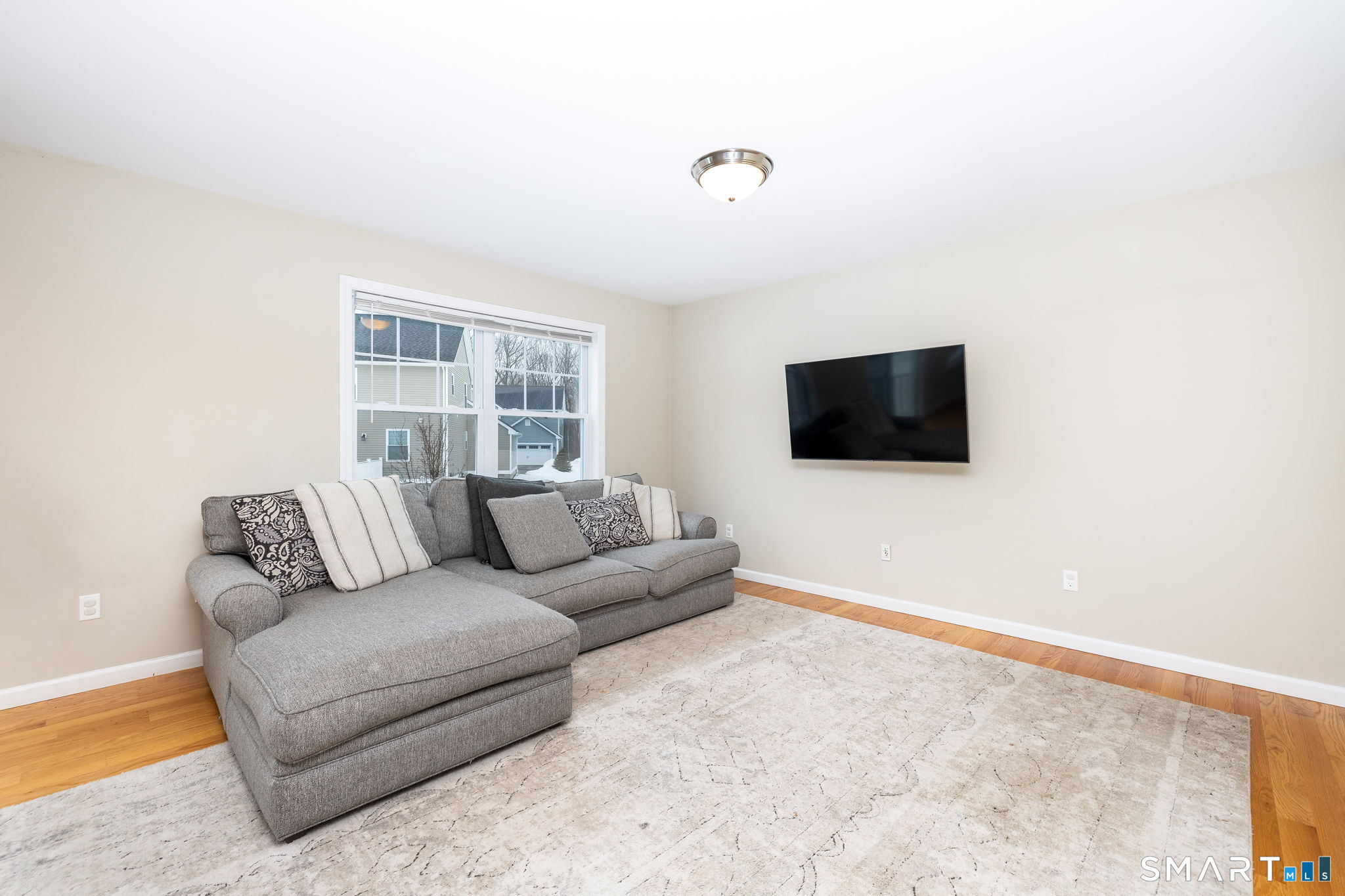 365 Allentown Road, Unit 34 Bristol, CT 06010 - Photo 10 of 43 a living room with furniture and a flat screen tv