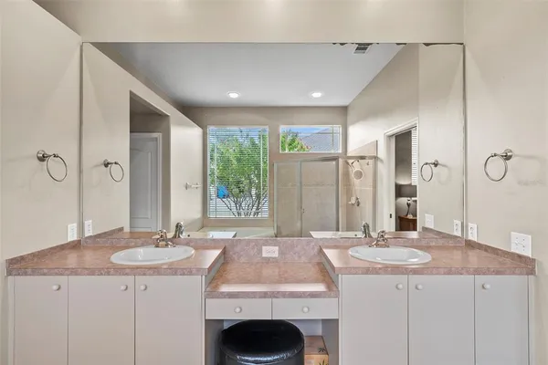 a view of a patio with table and chairs under an umbrella