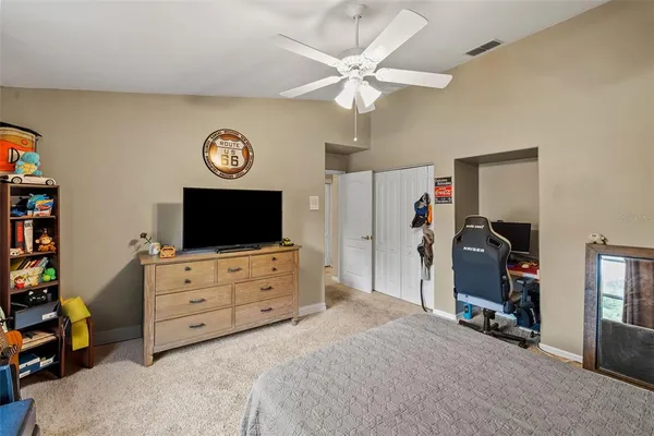 a view of a livingroom with furniture and a flat screen tv