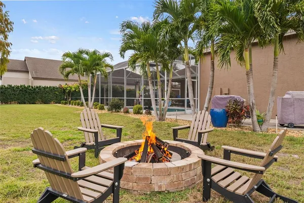 a house view with a sitting space and garden
