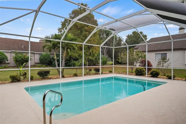 a view of a pathway with a wrought fence