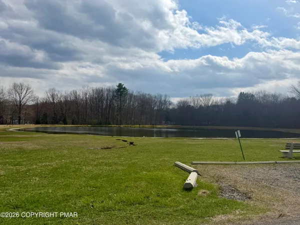 a view of a golf course with a lake