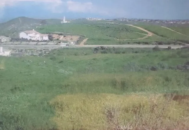 a view of a field with an trees