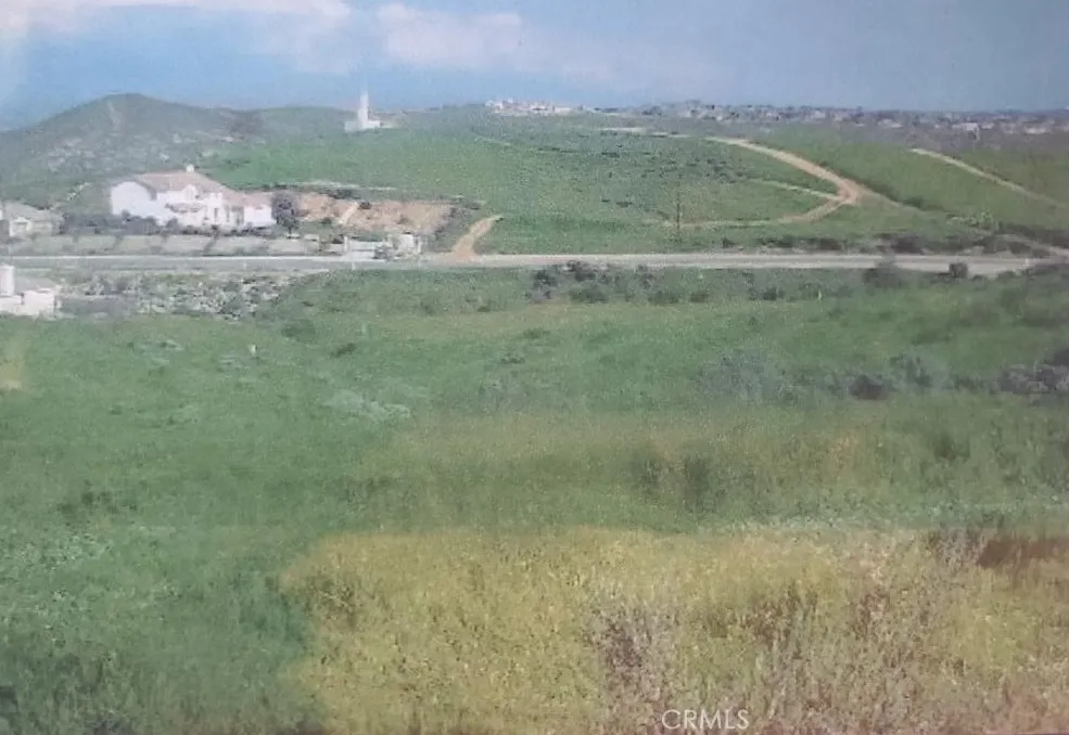 a view of a field with an trees