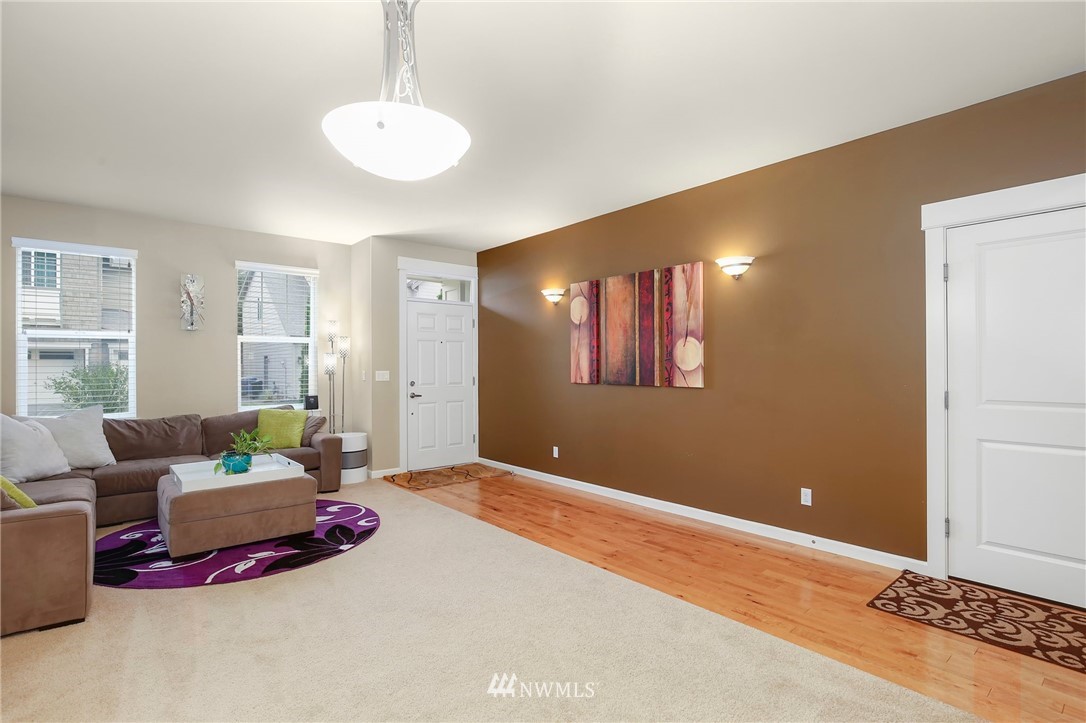 625 Kitsap Avenue Northeast Renton, WA 98059 - Photo 2 of 25 a bedroom with furniture and wooden floor