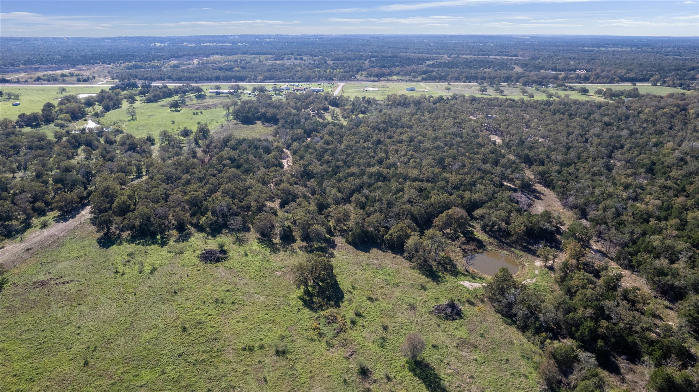 221 Old Waelder Road Flatonia, TX 78941 - Photo 13 of 27 a view of a forest with a lake view