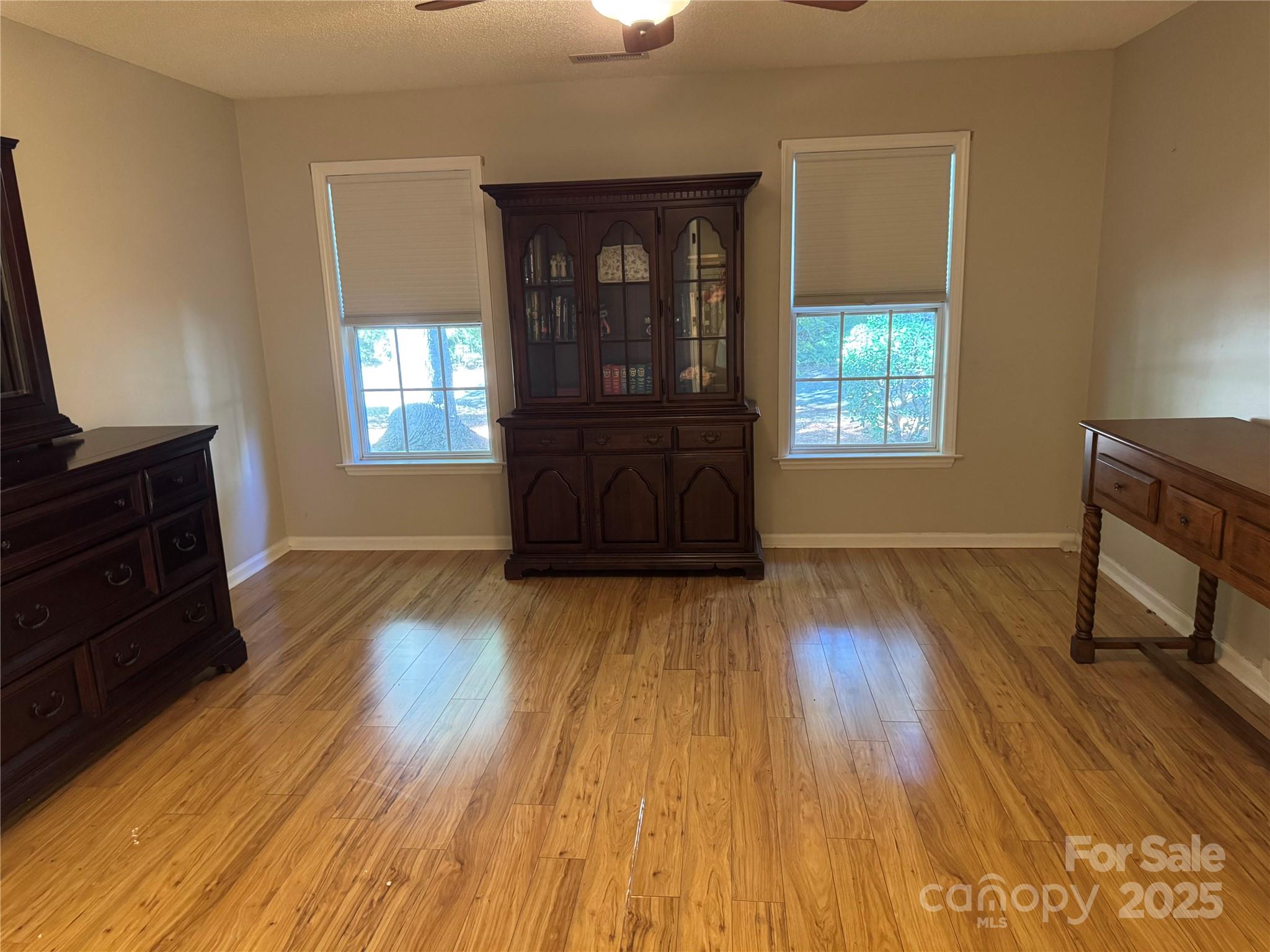 21120 Cold Spring Lane Cornelius, NC 28031 - Photo 13 of 22 a living room with wooden floors and a couch