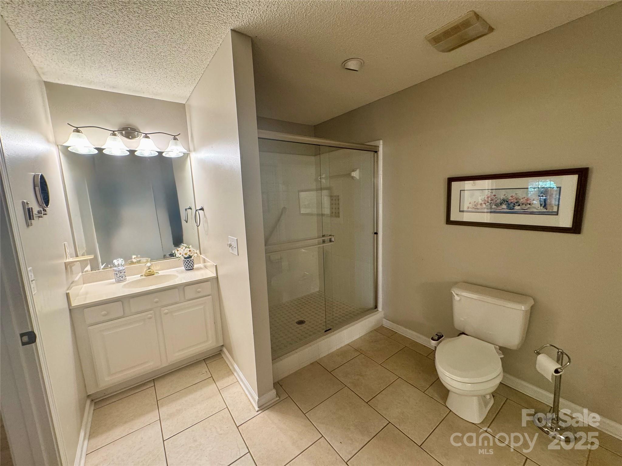 21120 Cold Spring Lane Cornelius, NC 28031 - Photo 14 of 22 a bathroom with a toilet sink and shower